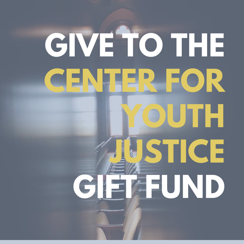 "Give to the Center for Youth Justice Gift Fund" text over blurred background of classroom