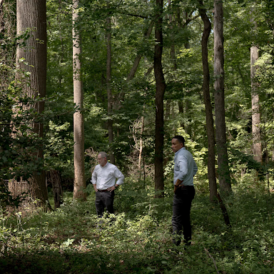 Marc Schindler, former assistant secretary and chief of staff of Maryland's Department of Juvenile Services, left, and Maryland state Sen. William C. Smith Jr. (D-Montgomery) survey the overgrown cemetery.
