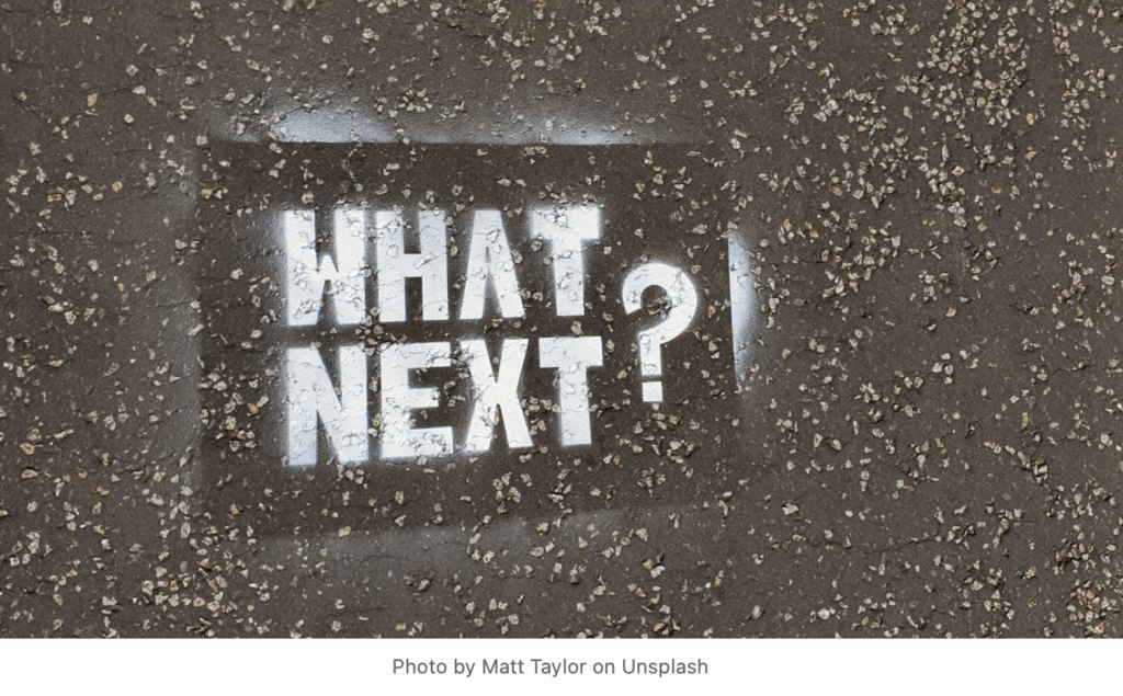 spray painted text "What Next?"