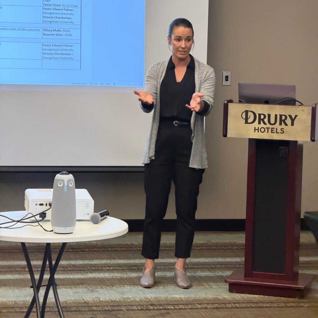 Victoria Chamberlin speaking at podium in front of SEJAY committee.