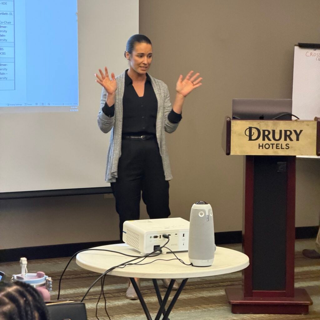 Victoria Chamberlin speaking at podium in front of SEJAY committee.