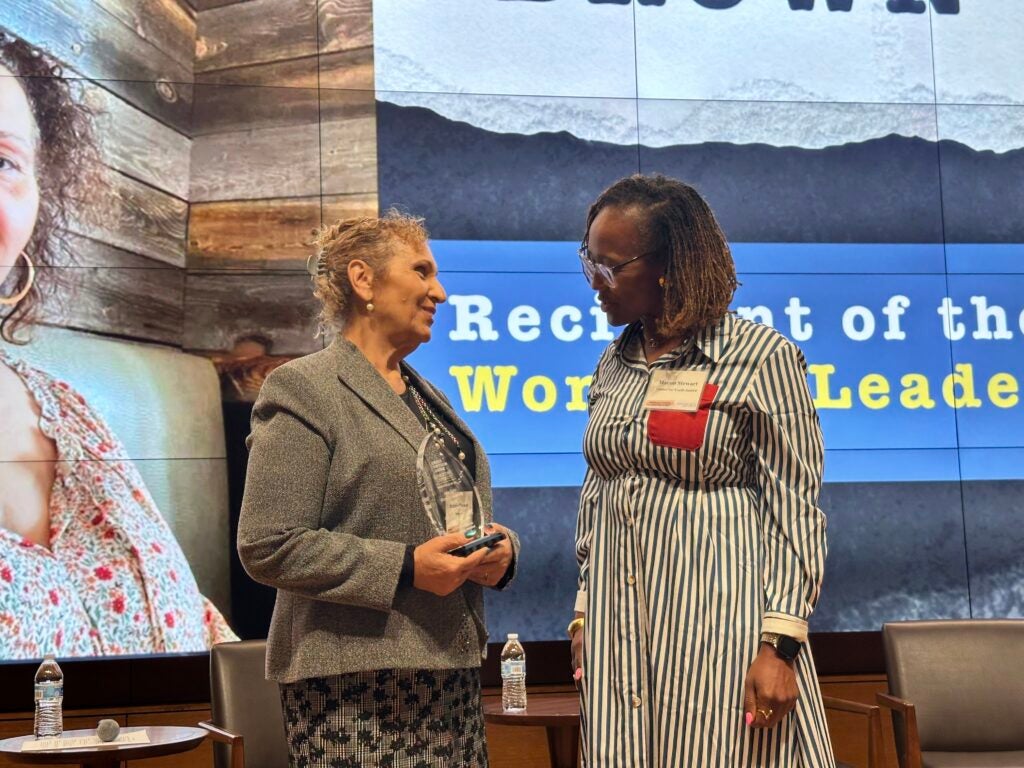 Sonnja Brown and Macon Stewart smiling on stage
