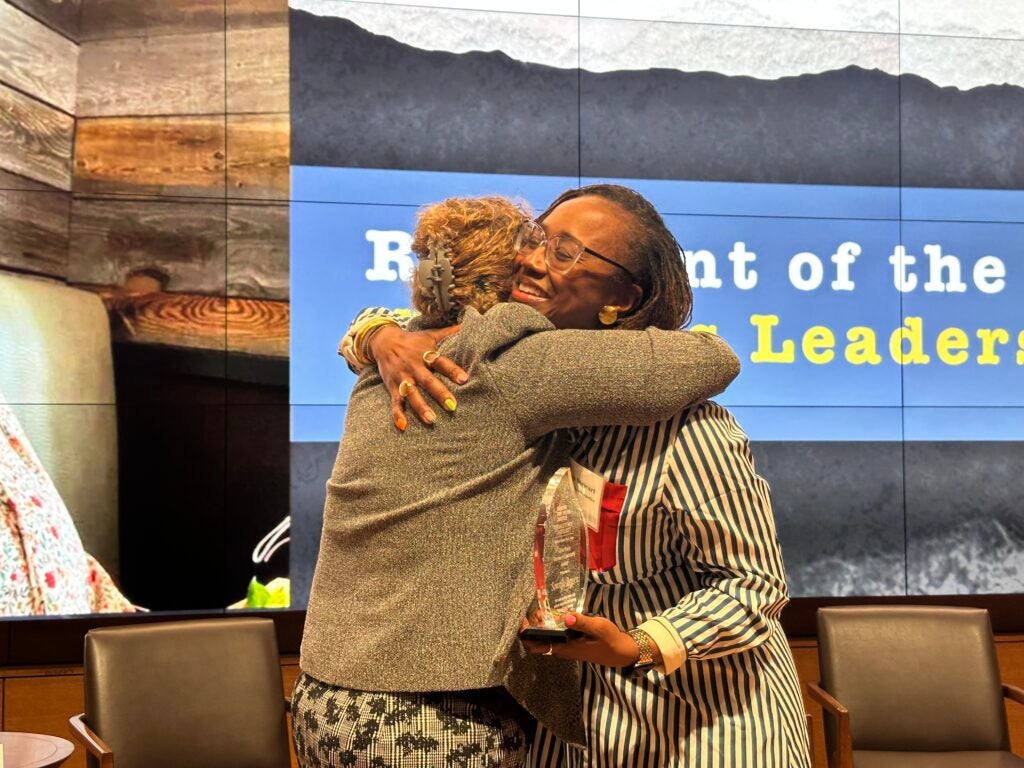 Sonnja Brown and Macon Stewart smiling on stage