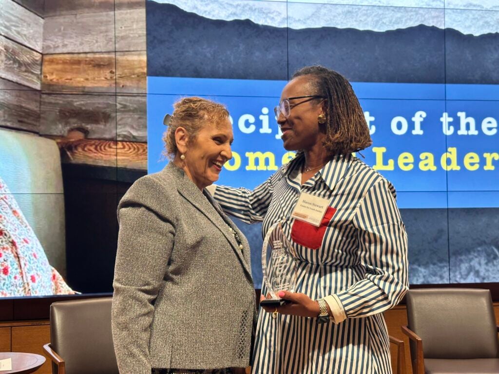 Sonnja Brown and Macon Stewart smiling on stage